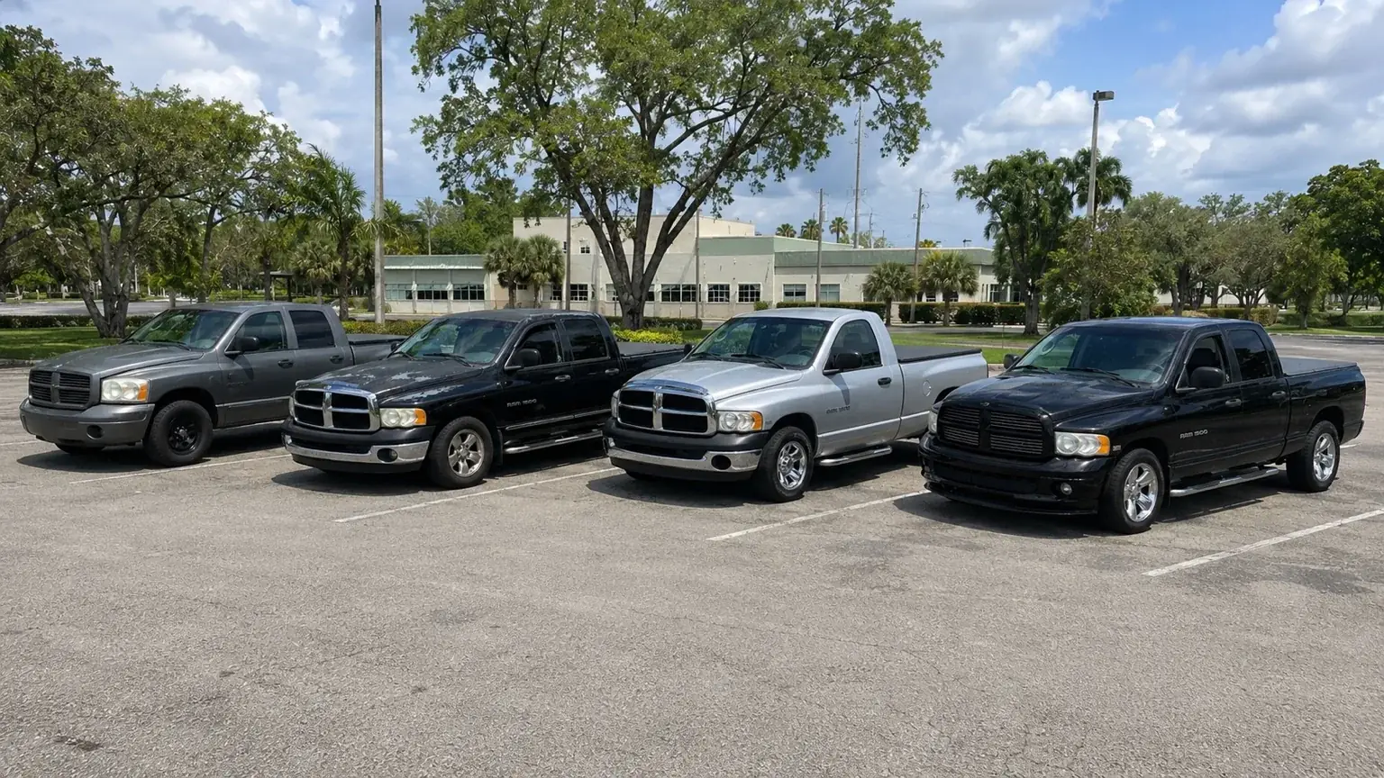 Four Kaiyo Rentals pickup trucks parked together